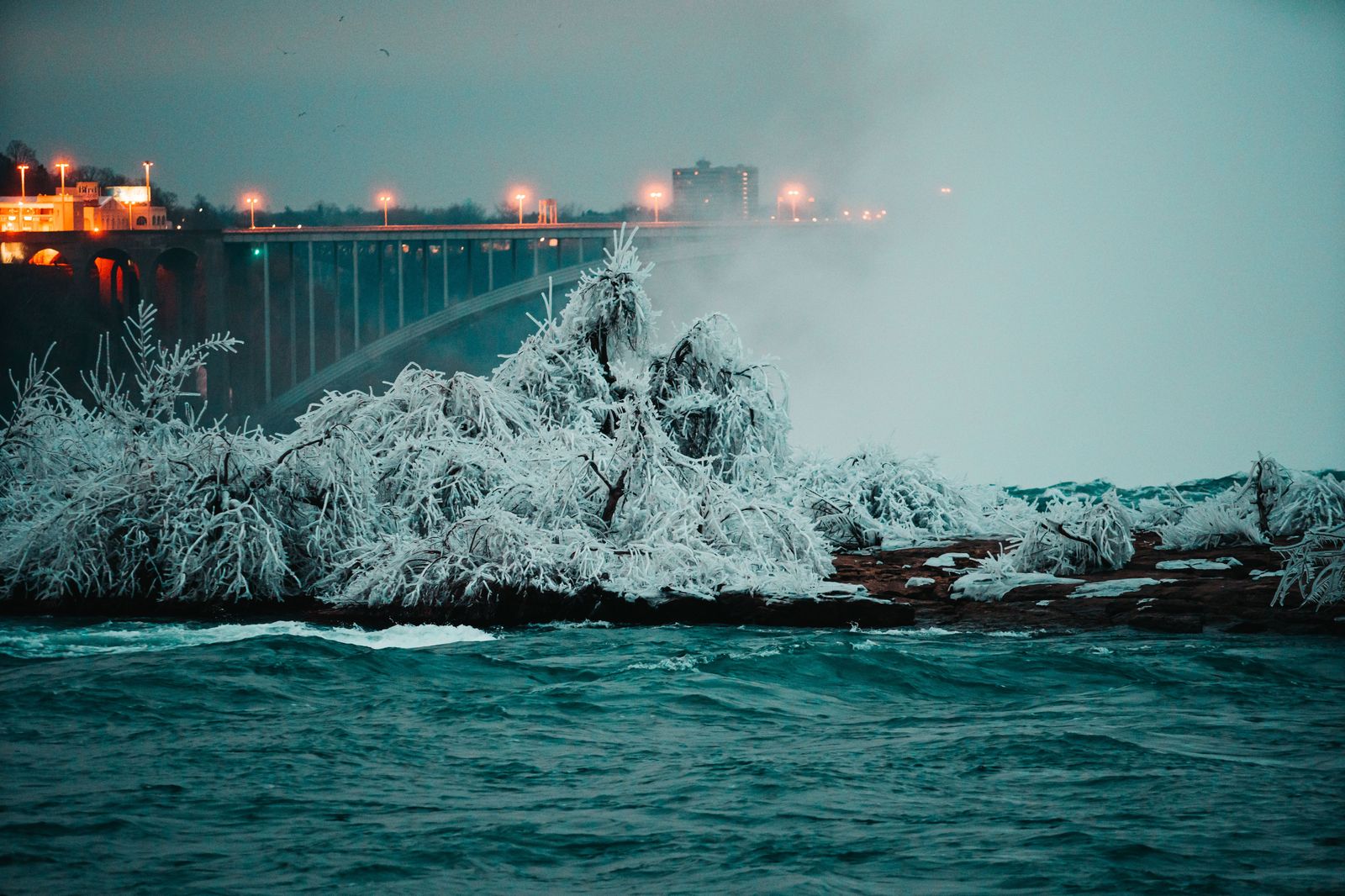 Niagara Falls lit up at night during a stagette weekend