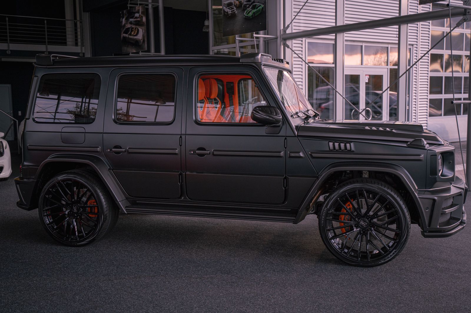 A black SUV with tinted windows parked near a film location