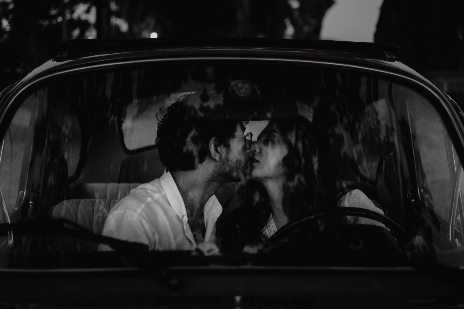 Couple stepping out of a black car for an evening in downtown Toronto