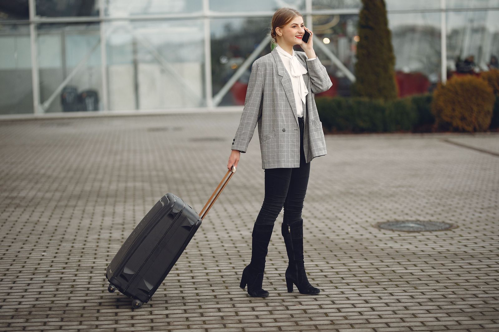 Business traveller with rolling suitcase heading to Billy Bishop airport