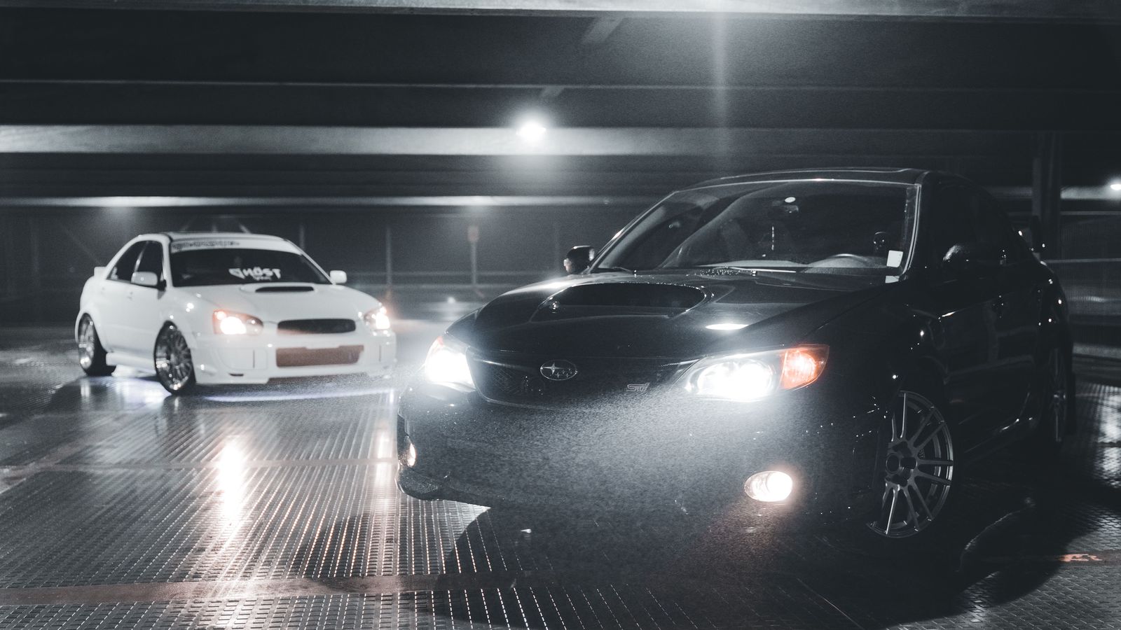 Black business sedan at night in Hamilton