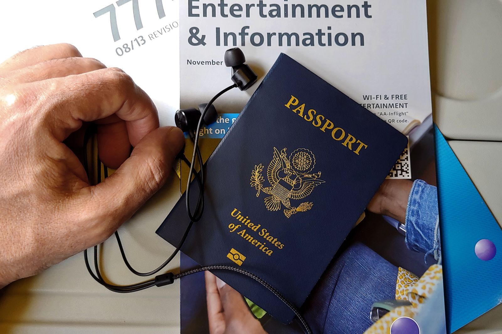 Passports and travel documents laid out on a car seat before crossing the border