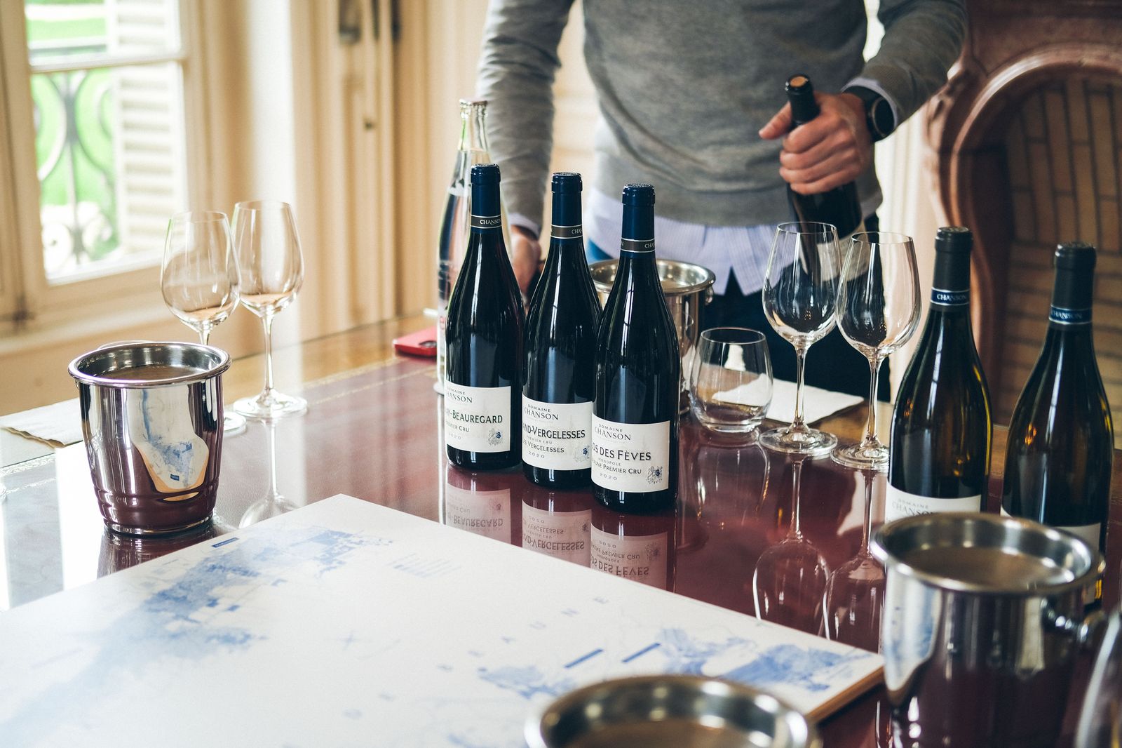 Glasses of white and red wine lined up for a tasting in a Niagara winery