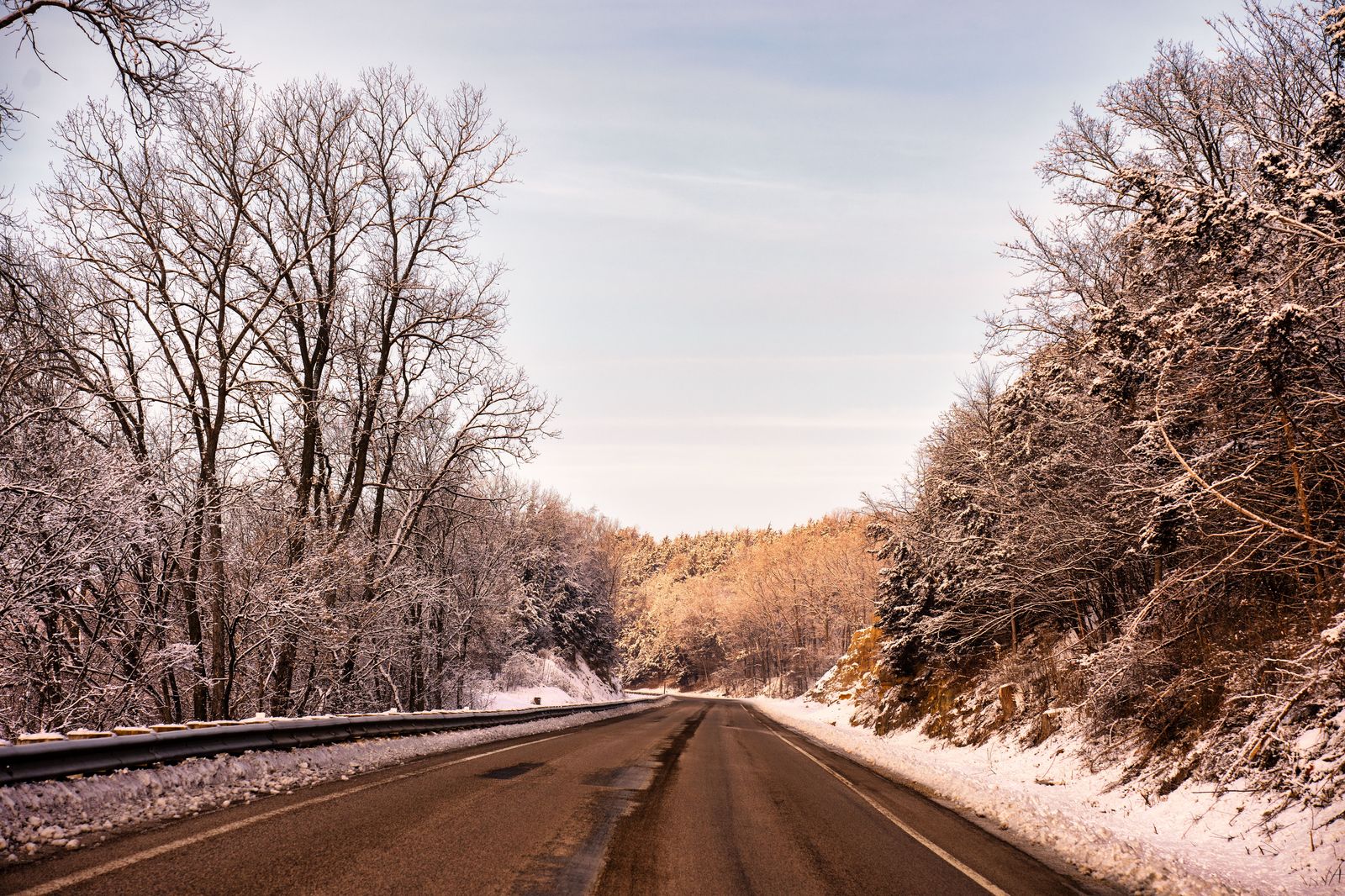 A snow-covered highway in winter on the Thruway between Rochester and Buffalo