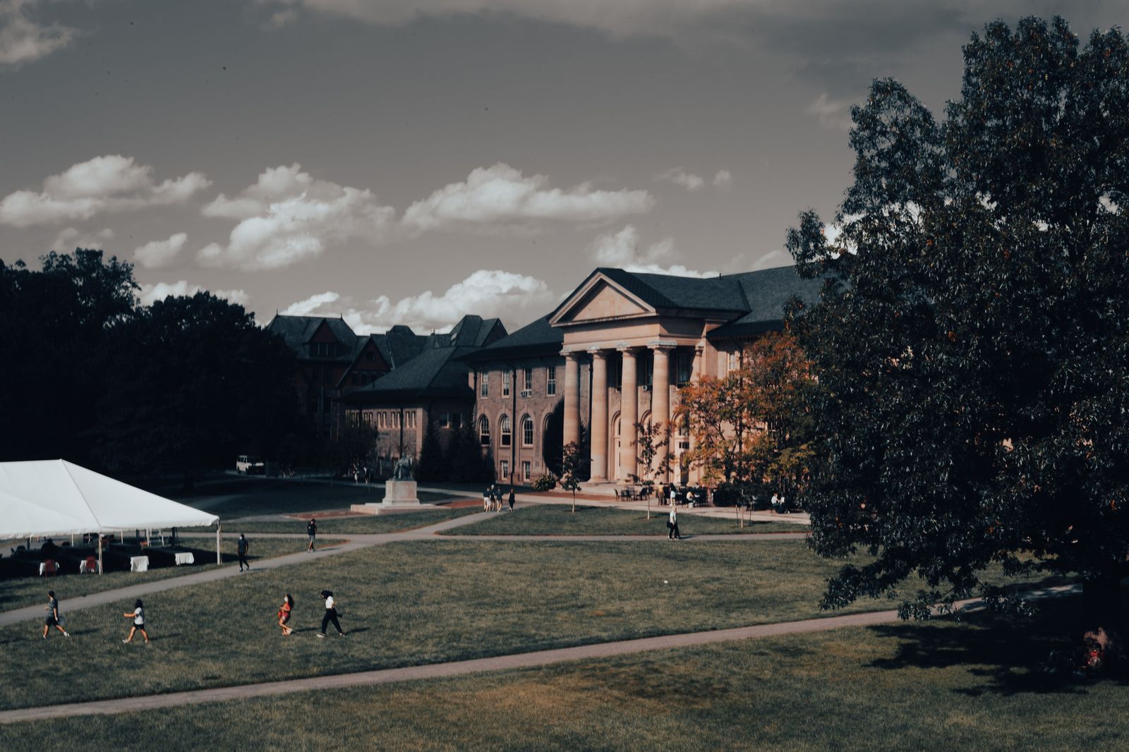 A university campus with red and gold autumn trees, typical of a Rochester to Hamilton academic visit